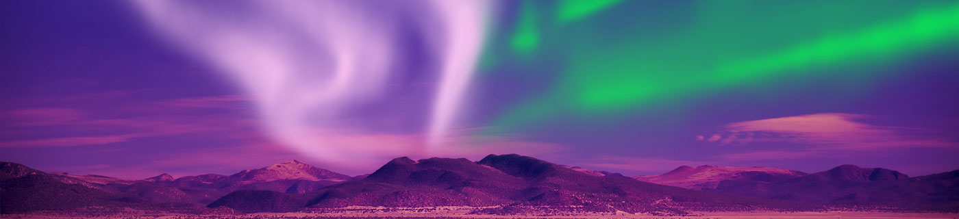 Purple mountains with aurora overhead